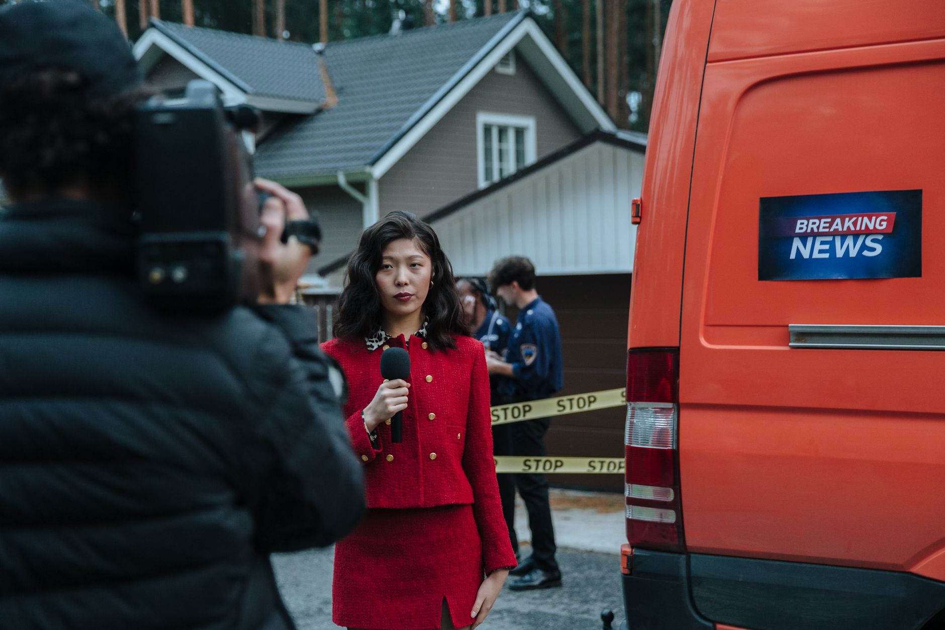 Broadcast journalist holding a microphone during an interview
